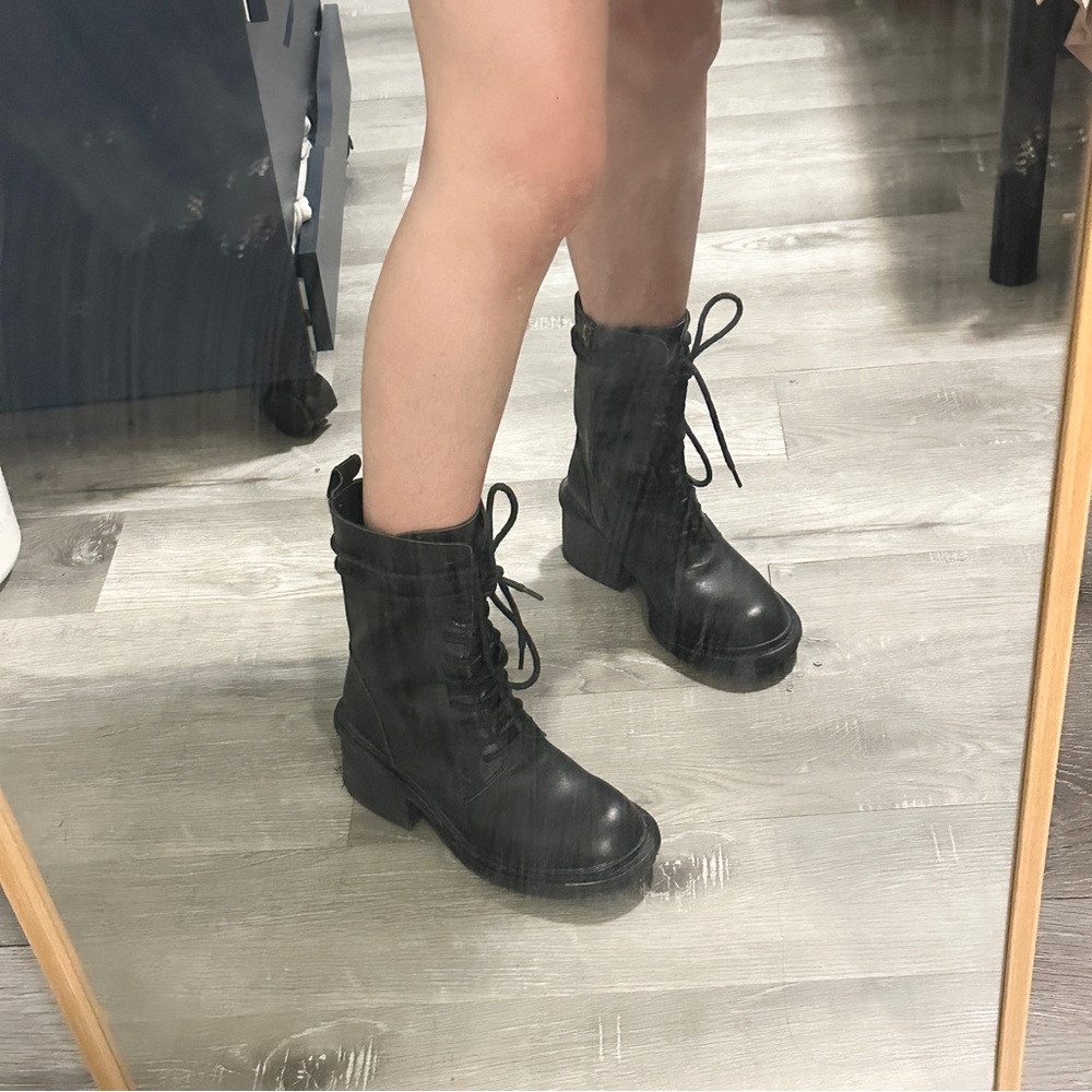 Black leather lace-up combat boots